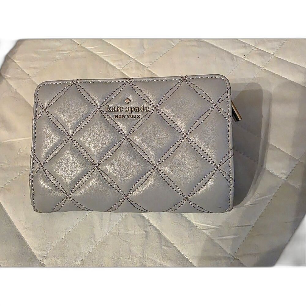 Kate Spade New York Natalia quilted leather medium compact bifold wallet.